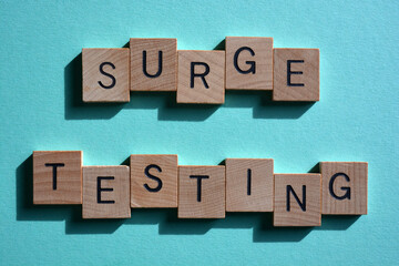 Surge Testing, words in wooden alphabet letters