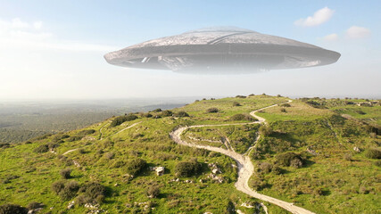 Large alien spaceship saucer hover over mountains, aerial view , Ufo over green hill and wide landscape, drone view  © ImageBank4U