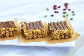 Chocolate avocado tart with pistachio date almond cranberry crust