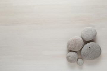 stone on a wooden background