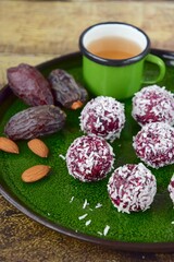 Beetroot quinoa date almond coconut energy balls with tea