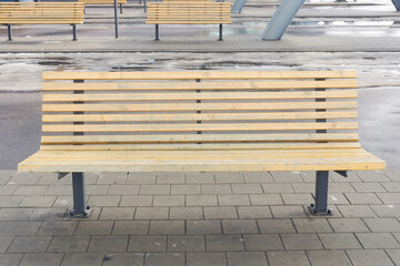 Waiting room bus station. Outdoor bus platform. Departure terminal background. Wooden bench for...