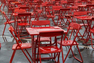 Red table and chairs after heavy rain