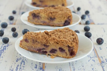 Slice of blueberry crumble cheesecake. Dessert for coffee time