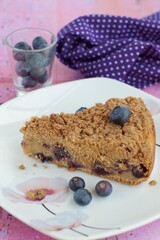Slice of blueberry crumble cheesecake. Dessert for coffee time