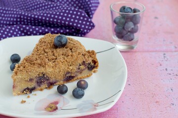 Slice of blueberry crumble cheesecake. Dessert for coffee time