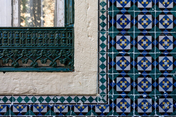 Close-up of wrought iron window frame and decorative azulejo tiles , Rua do Chão da Feira, Alfama, Lisbon, Portugal