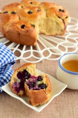 Homemade blueberry cinnamon rolls served with tea