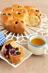 Homemade blueberry cinnamon rolls served with tea