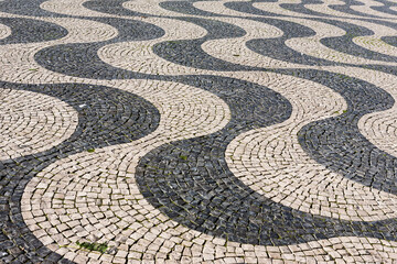 The famous 19th century wave-patterned cobblestone pavement, Rossio Square (officially King Pedro...