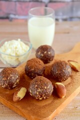 Healthy organic brazil nut coconut chocolate energy balls served with milk