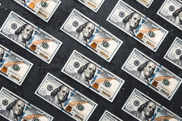 Fototapeta na wymiar One hundred dollar bills are creatively laid out. Business concept, development perspective.