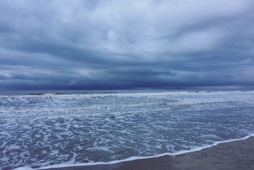 Naklejka na ściany i meble Dark cloudy seascape, north sea