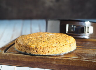 Round pumpkin pie, with natural ingredients, taken out of the baking dish. Healthy homemade baked goods.