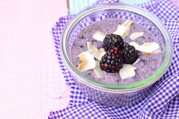 Blackberry coconut chia seed pudding with coconut chips