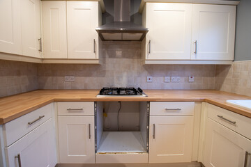 A brand new modern British home showing the Kitchen with a missing cooker oven
