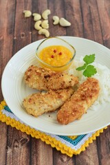 Chicken fingers breaded with cashew nuts and coconut flakes. Served with mango dip and steamed rice
