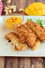 Chicken fingers breaded with cashew and coconut flakes. Served with mango red pepper dip