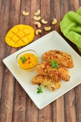Chicken fingers breaded with cashew and coconut flakes. Served with mango red pepper dip
