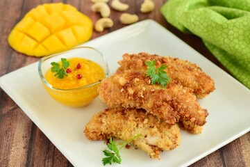Chicken fingers breaded with cashew and coconut flakes. Served with mango red pepper dip