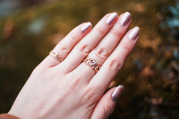 a hand of women showing her rings