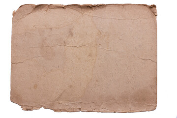 Isolate of an old shabby piece of cardboard with jagged, ragged edges and stained.