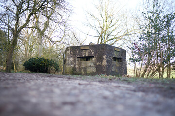 A brutalist cold gritty concrete world war two, ww2, pillbox war bunker defence fortress in a dirty...