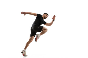 In jump. Caucasian professional sportsman training isolated on white studio background. Muscular, sportive man practicing. Copyspace. Concept of action, motion, youth, healthy lifestyle.