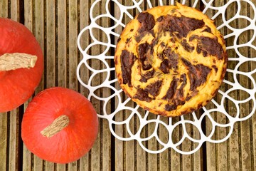 Homemade pumpkin chocolate swirl cheesecake. Flat lay