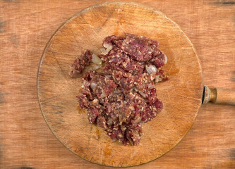 Minced beef to make hamburgers, with onion and grated cheese