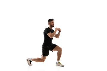 Fototapeta na wymiar Squats. Caucasian professional sportsman training isolated on white studio background. Muscular, sportive man practicing. Copyspace. Concept of action, motion, youth, healthy lifestyle.