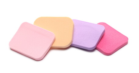Beauty blender pile, colorful cosmetic makeup applicator sponge set isolated on white background