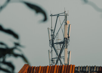 Closeup telecommunication tower in a rural location. Telecom tower antennas and satellite transmits...