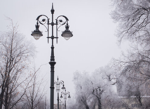 A beautiful vintage street light on cloudy sky background, Almaty

