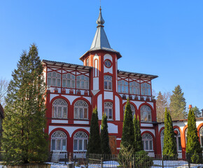 Fototapeta na wymiar A three-storey building of a boarding house with a tower in the city of Svetlogorsk, Kaliningrad region