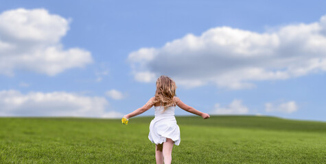 a Girl enjoy in open field nature sunny day.