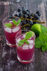 Grape mint soda mocktail with fresh grapes background