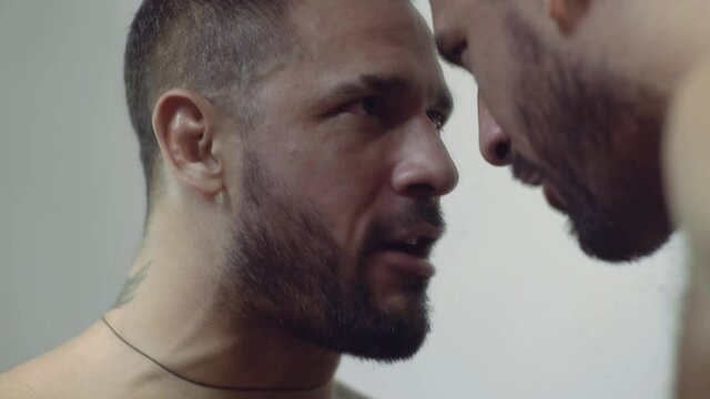 Psychological problems. Split personality, schizophrenia. Man talking with mirror reflection.