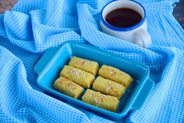 Kastengel or Kue Keju or Dutch Indonesian cheese stick cookies, served with coffee