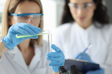 Scientists in laboratory are conducting chemical experiments