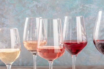 Wine colors. Many glasses of wine, side view