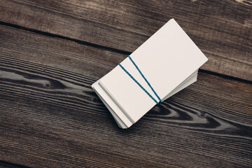 bundles of business cards on a wooden background top view work finance