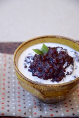 Bubur ketan hitam,  an Indonesian sweet dessert made from black glutinous rice porridge with coconut milk and palm sugar 