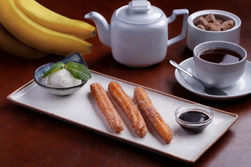 cup of tea with banana fried sticks