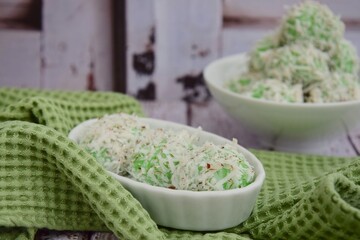 Indonesian Cuisine, Klepon or Traditional Pandanus Rice Balls Made From Glutinous Flour and Grated Coconut with Palm sugar Filling