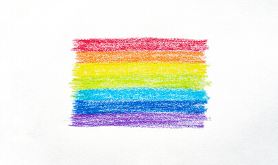 Abstract wax crayons rainbow flag colors on white paper.