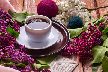 Coffee Cup And Colorful Lilac Flowers On Garden wooden Table