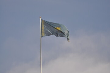 Fototapeta na wymiar The flag of Kazakhstan develops in the wind