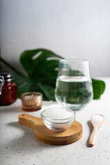 selective focus. Collagen powder in a glass container. light background. copyspace. Extra protein intake. Natural beauty and Health supplement for skin, bones, joints and intestines