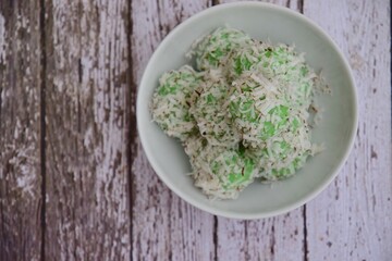 Indonesian Cuisine, Klepon or Traditional Pandanus Rice Balls Made From Glutinous Flour and Grated Coconut with Palm sugar Filling